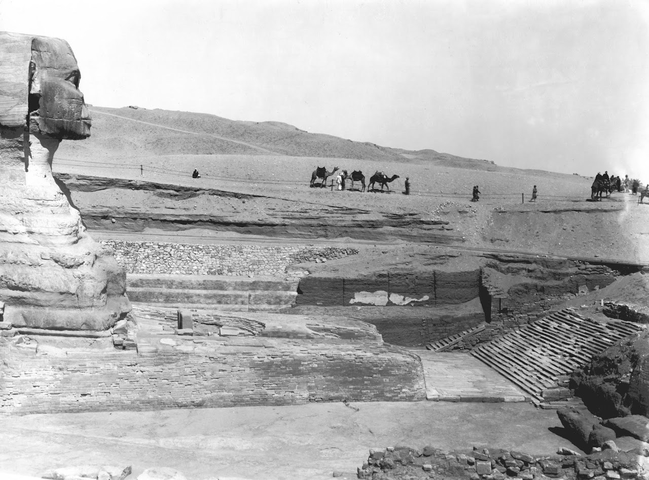 The front and forelegs of the Great Sphinx following restoration work to the neck and Nemes showing multiple periods of contruction and repair.