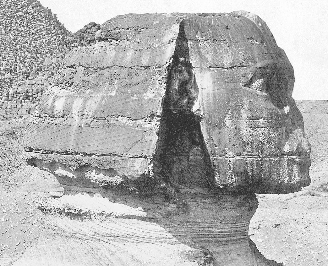 A close up detail of the head of the Great Sphinx of Giza from an early photograph showing the limestone sedimentary layers from whihc it is made. 