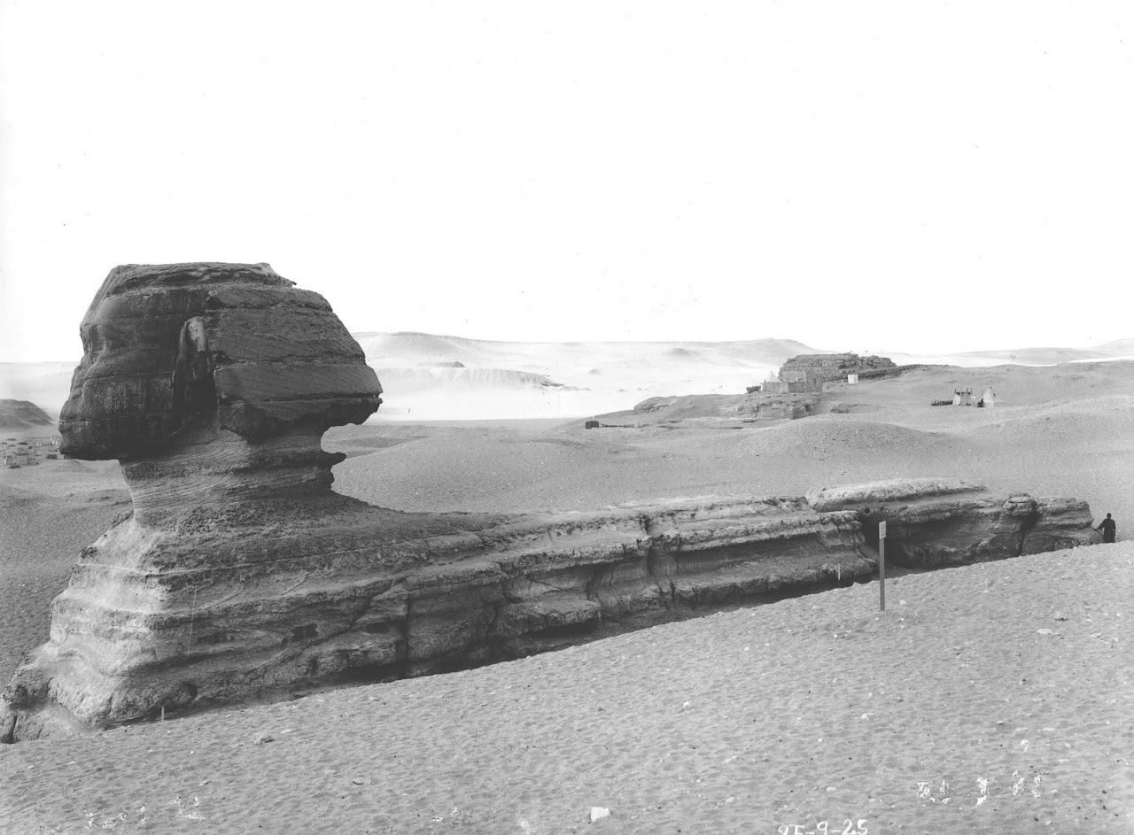 Image: A post in the sand marks the location of the bedrock fissure across the back of the Sphinx