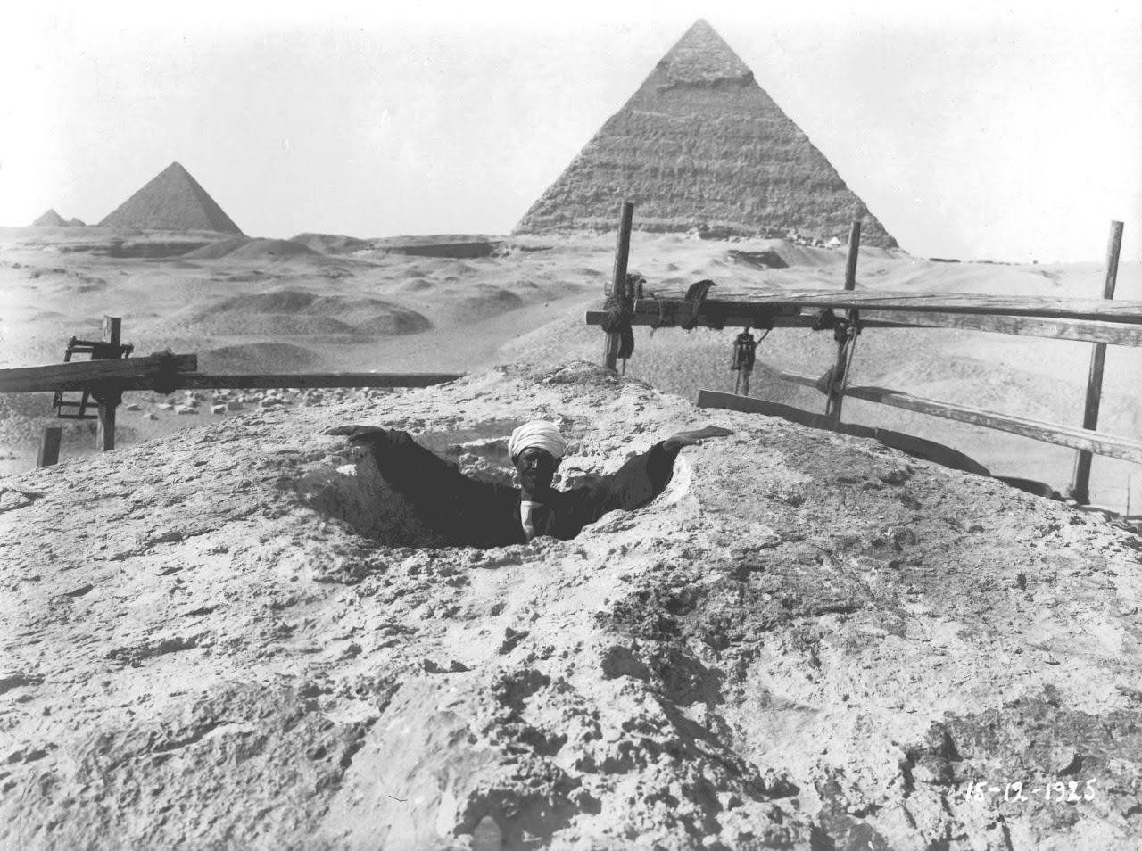 Image: The head cavity of the Great Sphinx with a gentleman inside giving some indication of its original dimensions before restoration